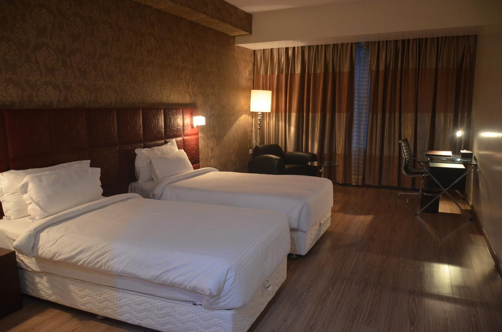 Hotel Patliputra Exotica Патна Стая снимка